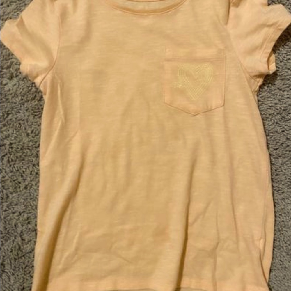 SO high-low tee. Orange shirt with yellow  heart outline on pocket